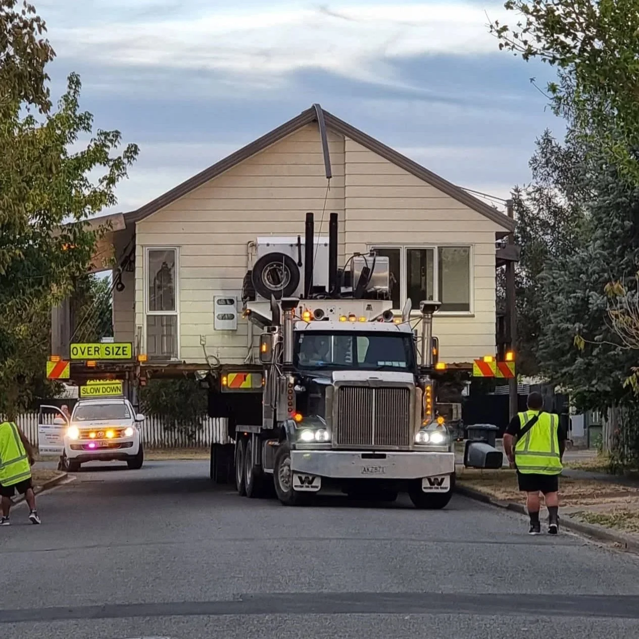A house being relocated on a Houses On The Move truck