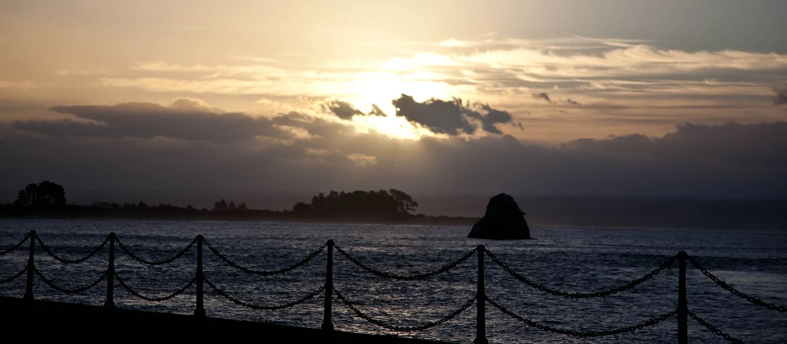 Sunset over the water at Tahunanui Beach in Nelson