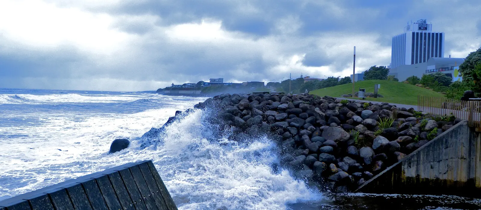 Waves breaking against the sea wall on the New Plymouth coastal walkway