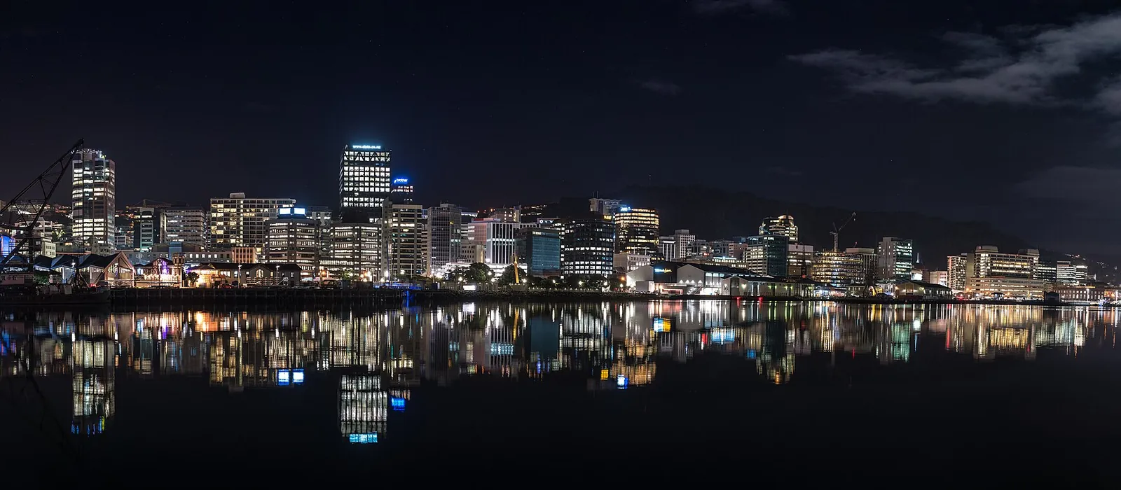 Wellington city skyline at night reflected in the harbour